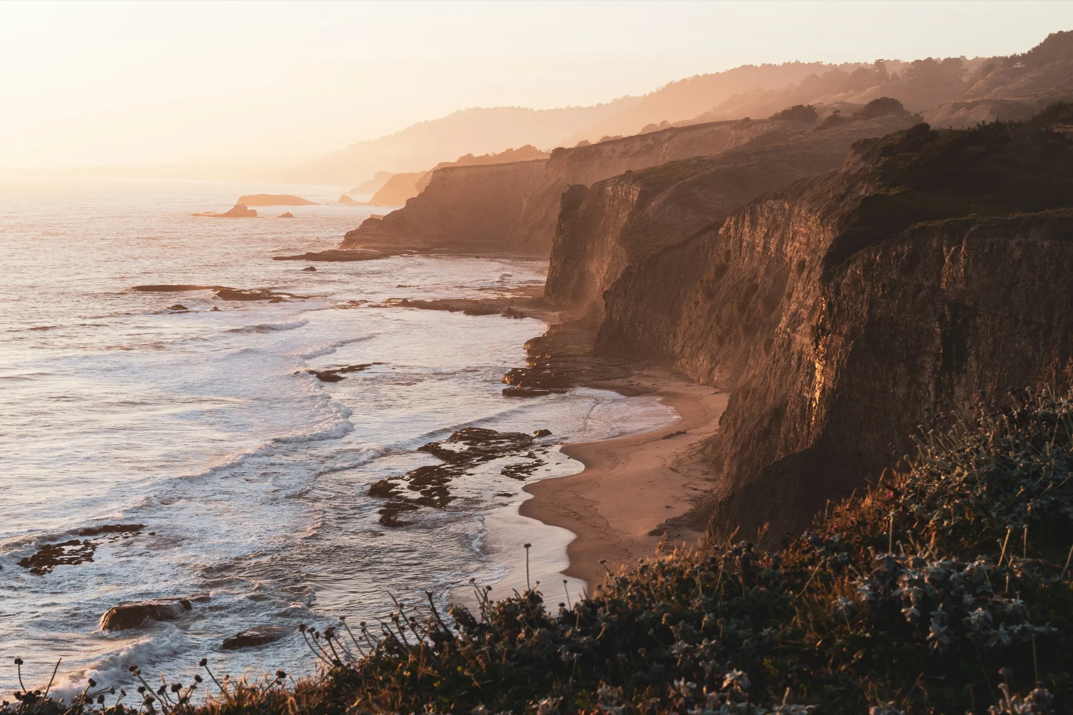 A coastal cliff at golden hour.